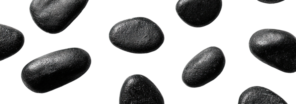 Scattered dark gray stones against a black background