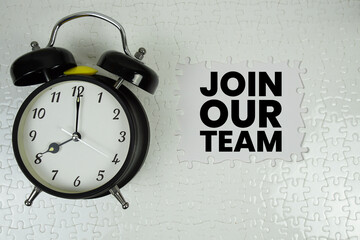 Join Our Team text with alarm clock on white background