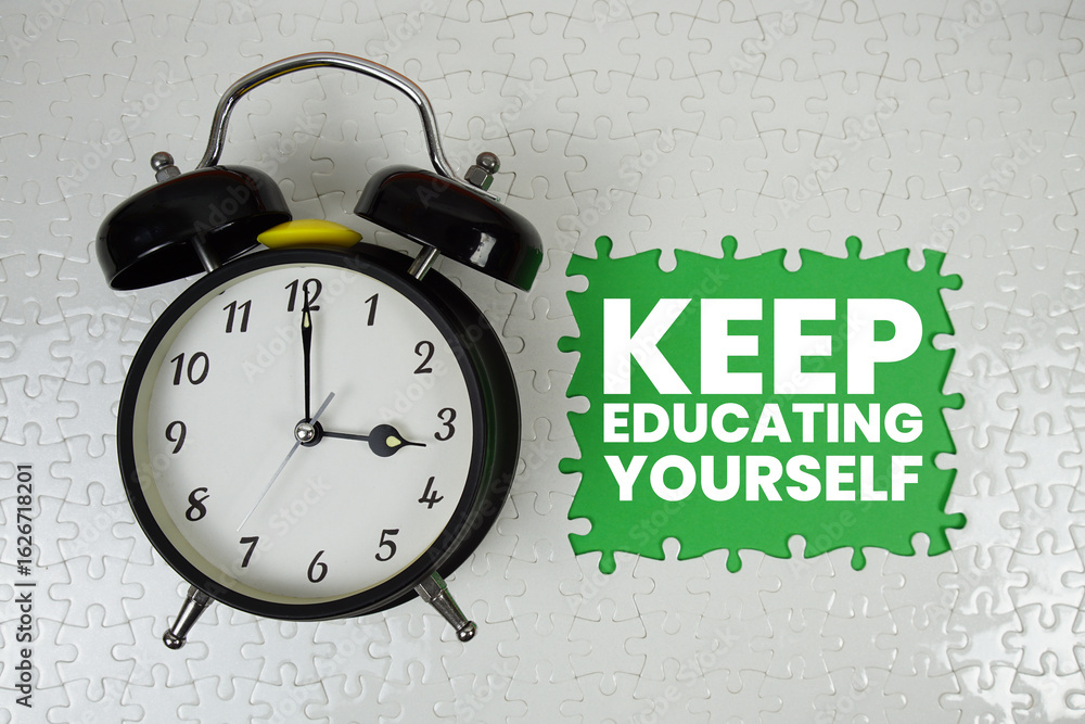 Poster keep educating yourself text with alarm clock on green background
