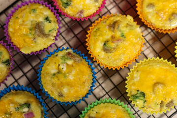 Egg bite muffins in brightly colored muffin cups.