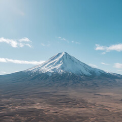 Fototapeta premium The image depicts a breathtaking panoramic view of a snow-covered mountain peak amidst a bright, sunny sky.