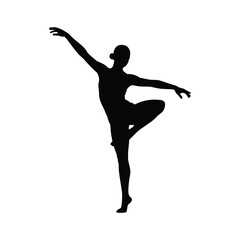 Silhouette of a graceful ballerina performing an arabesque pose