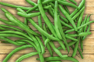 A bunch of freshly picked and washed runner beans on a kitchen table