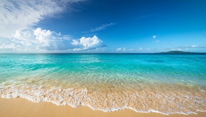 Fototapeta premium crystal clear waves lap against a golden shore at a tropical beach on a sunny day