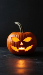 Fototapeta premium A single carved pumpkin glows on a matte black surface under dramatic lighting. Ideal for Halloween campaigns, seasonal decor branding, and World Art Day visuals with minimalist flair.