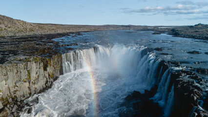 Majestic Selfoss waterfall with glorious rainbow and natural surroundings in iceland