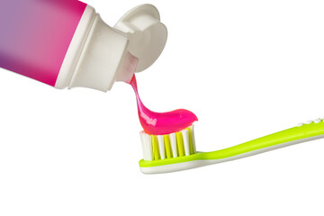 Pink toothpaste being squeezed onto green toothbrush on transparent background