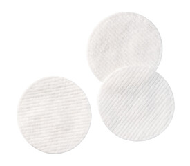 Three white cotton pads on transparent background