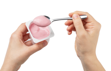 Woman eating pink yogurt with spoon from plastic container on transparent background