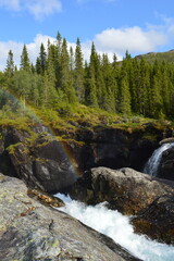 Rainbow over Rjukandefossen, Norwegian waterfall