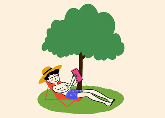Relaxing under the tree with a book in summer
