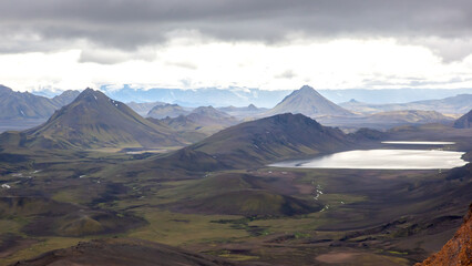 Majestic mountain landscape of Iceland with lakes and valleys under a cloudy sky