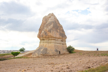 Majestic rock formation rises in Cappadocia, Turkey, under a cloudy sky