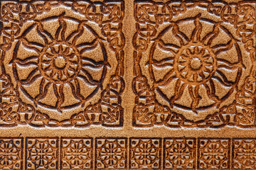 Close-up of an old embossed leather Celtic design journal cover background backdrop.