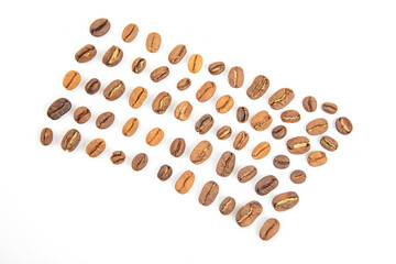 Coffee beans arranged in various shades showing diversity and freshness of the harvest