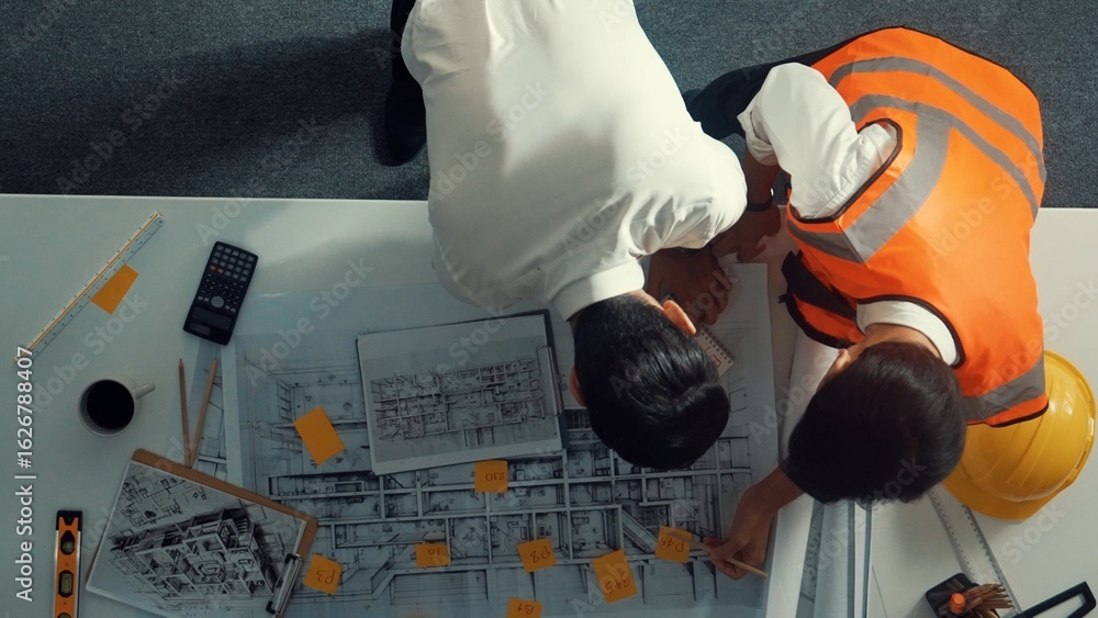 Poster top view of smart architect and skilled civil engineer team working together to design building cons