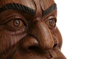 Closeup detail of traditional wooden mask showing carved eyes, nose, and eyebrows on isolated white background