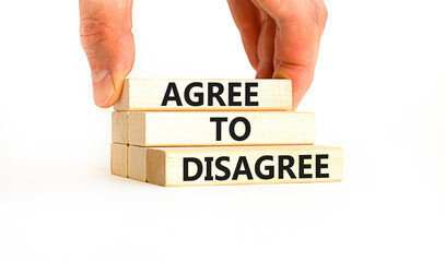 Agree to disagree symbol. Concept words Agree to disagree on beautiful wooden block. Businessman's hand. Beautiful white background. Business and agree to disagree concept. Copy space.
