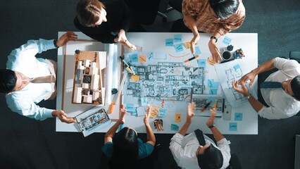 Top view of smart manager clapping hands and putting hands together to celebrate project. Aerial...