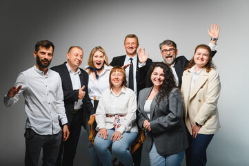 Business team celebrating success in meeting with leader