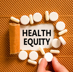 Health equity symbol. Concept words Health equity on beautiful white paper. White pills tablets....