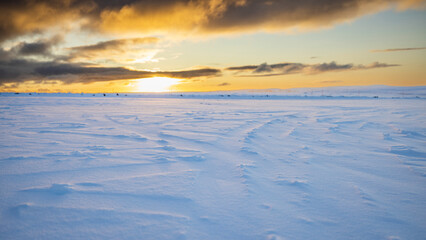 sunset in snow flat