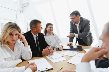 Business team discussing strategy during important meeting in modern office