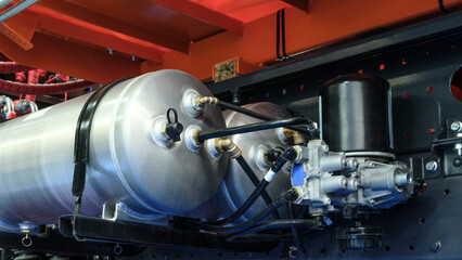 Bundle of pipes connected to industrial hydraulic pneumatic machine, industrial concept background