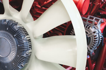 Large diesel engine of tractor with white air-cooled propeller