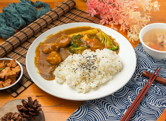 Japanese style Vegetable Chicken Curry Rice with Side Dishes in plate side view of Asian food