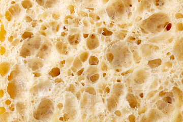 Fototapeta na wymiar Ciabatta, sourdough bread texture macro shot. Close up. Copy space.