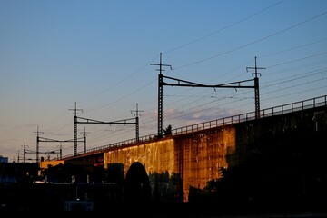 Train Tracks and Catenary System During Golden Sunrise (Queens, New York, USA)