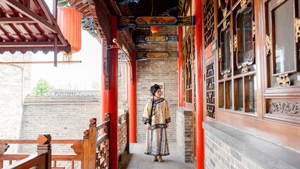 Qing dynasty girl in traditional Chinese architecture