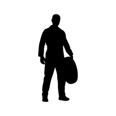 A bold silhouette of a man, likely a mechanic, standing confidently, holding a tire.