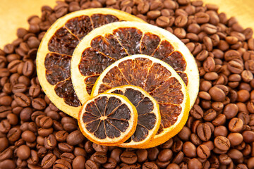Dried orange slices arranged on coffee beans for unique aroma and flavor combination