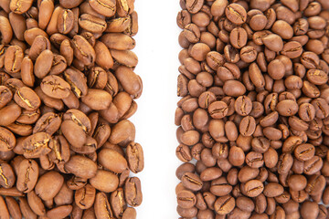 Roasted coffee beans arranged side by side showcasing different roast levels and textures