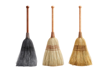 Three small, decorative brooms, displayed side-by-side