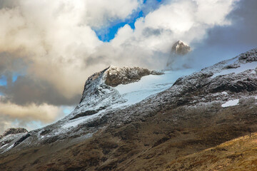Breathtaking mountain landscape near Norway showcasing snow and dramatic clouds