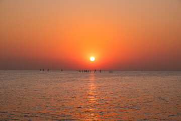  sunset view with vivid orange and red tones over a calm sea