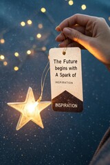 Hand Holding Inspiring Tag with A Spark of Light and Stars