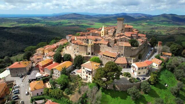 Italy travel and landmarks. Capalbio - charming small traditional top hill village (borgo) in Tuscany. Grosetto province. considered one of the most beautiful villages of Italy. aerial drone 4k video