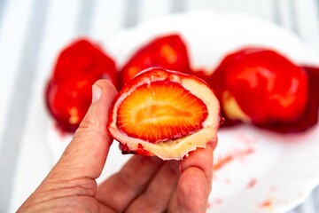 The iconic and delicious Brazilian strawberry of love, prepared with fresh strawberries, white brigadeiro and crunchy caramel on the surface. Morango do amor