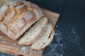 loaf of bread on wooden table