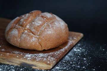 loaf of bread on wooden board