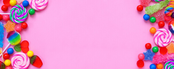 Sweet collection of candies. Top down view double border over a pink banner background.