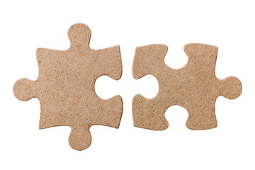 Fototapeta premium Two light brown puzzle pieces, joined