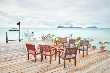 Wooden platform with seats by the sea, holiday relaxation concept, Borneo, Malaysia.