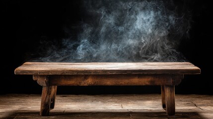 A rustic wooden table stands against a black backdrop, while wisps of smoke curl upward, evoking a sense of mystery in the dimly lit environment.