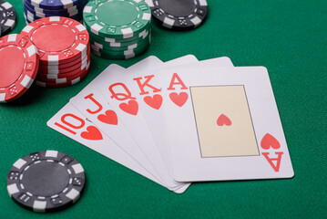 Playing card game poker in casino with chips, bets and risk. Cards and chips on elt