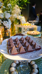 Delicious triangular chocolates on a tray.